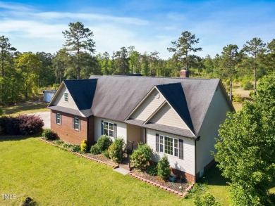 Welcome to your own 3-bedroom, 2-bath country retreat, perfectly on Carolina Lakes Country Club in North Carolina - for sale on GolfHomes.com, golf home, golf lot