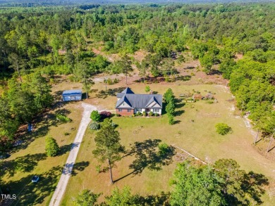 Welcome to your own 3-bedroom, 2-bath country retreat, perfectly on Carolina Lakes Country Club in North Carolina - for sale on GolfHomes.com, golf home, golf lot