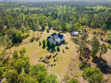 Welcome to your own 3-bedroom, 2-bath country retreat, perfectly on Carolina Lakes Country Club in North Carolina - for sale on GolfHomes.com, golf home, golf lot