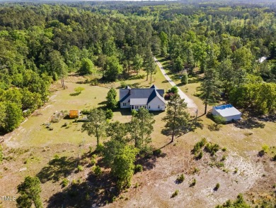 Welcome to your own 3-bedroom, 2-bath country retreat, perfectly on Carolina Lakes Country Club in North Carolina - for sale on GolfHomes.com, golf home, golf lot