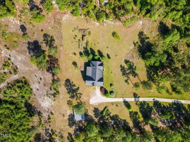 Welcome to your own 3-bedroom, 2-bath country retreat, perfectly on Carolina Lakes Country Club in North Carolina - for sale on GolfHomes.com, golf home, golf lot