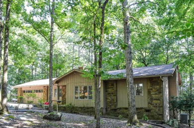Enjoy the serenity and beauty of the forest from the deck of on Cortez Golf Course in Arkansas - for sale on GolfHomes.com, golf home, golf lot