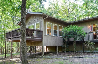 Enjoy the serenity and beauty of the forest from the deck of on Cortez Golf Course in Arkansas - for sale on GolfHomes.com, golf home, golf lot