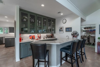 Exquisite and stylishly updated golf course home with enclosed on Slick Rock Golf Course - Horseshoe Bay in Texas - for sale on GolfHomes.com, golf home, golf lot