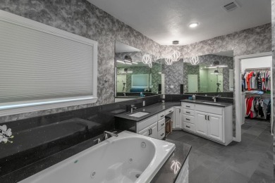 Exquisite and stylishly updated golf course home with enclosed on Slick Rock Golf Course - Horseshoe Bay in Texas - for sale on GolfHomes.com, golf home, golf lot