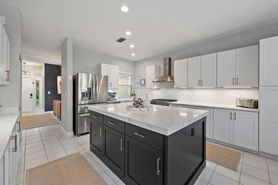 Exquisitely transformed residence in the Spanish-inspired on PGA National Golf Club in Florida - for sale on GolfHomes.com, golf home, golf lot