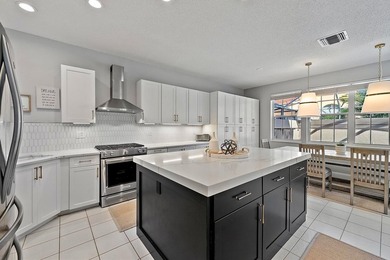 Exquisitely transformed residence in the Spanish-inspired on PGA National Golf Club in Florida - for sale on GolfHomes.com, golf home, golf lot