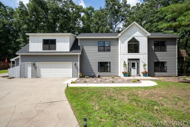 Welcome to 309 Woodview, a beautifully reimagined 4-bedroom on Eagle Island Golf Club in Michigan - for sale on GolfHomes.com, golf home, golf lot