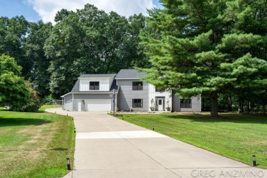 Welcome to 309 Woodview, a beautifully reimagined 4-bedroom on Eagle Island Golf Club in Michigan - for sale on GolfHomes.com, golf home, golf lot