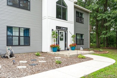 Welcome to 309 Woodview, a beautifully reimagined 4-bedroom on Eagle Island Golf Club in Michigan - for sale on GolfHomes.com, golf home, golf lot