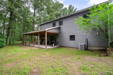Welcome to 309 Woodview, a beautifully reimagined 4-bedroom on Eagle Island Golf Club in Michigan - for sale on GolfHomes.com, golf home, golf lot