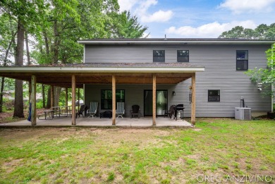 Welcome to 309 Woodview, a beautifully reimagined 4-bedroom on Eagle Island Golf Club in Michigan - for sale on GolfHomes.com, golf home, golf lot