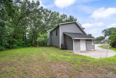 Welcome to 309 Woodview, a beautifully reimagined 4-bedroom on Eagle Island Golf Club in Michigan - for sale on GolfHomes.com, golf home, golf lot