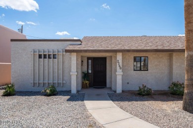 VERY clean 2-bedroom, 2-bathroom home with a versatile den! This on London Bridge Golf Course in Arizona - for sale on GolfHomes.com, golf home, golf lot