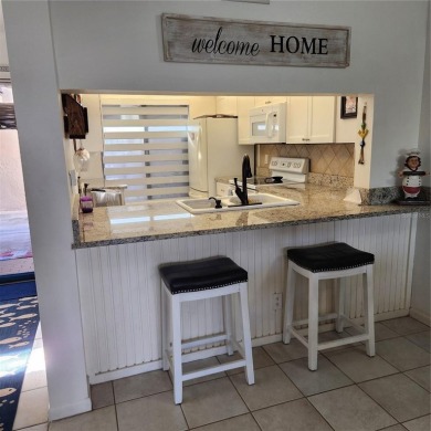 NON FLOODED 1st FLOOR WATERFRONT VILLA IN ISLA DEL SOL*** This on Isla Del Sol Yacht and Country Club in Florida - for sale on GolfHomes.com, golf home, golf lot