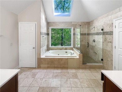 Welcome to this stunning 4-bedroom, 3.5-bath Woodstock home that on Canongate At Eagle Watch Golf Club in Georgia - for sale on GolfHomes.com, golf home, golf lot