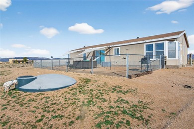 Set on 5 acres in Mountain Vista Ranches, this AR/5A-zoned ranch on Valle Vista Golf Course in Arizona - for sale on GolfHomes.com, golf home, golf lot