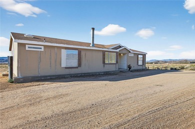 Set on 5 acres in Mountain Vista Ranches, this AR/5A-zoned ranch on Valle Vista Golf Course in Arizona - for sale on GolfHomes.com, golf home, golf lot