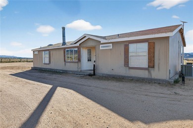 Set on 5 acres in Mountain Vista Ranches, this AR/5A-zoned ranch on Valle Vista Golf Course in Arizona - for sale on GolfHomes.com, golf home, golf lot