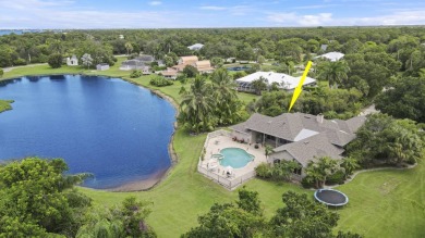 Beautiful lakefront home on 1.25 in the gated community of on Harbour Ridge Yacht and Country Club in Florida - for sale on GolfHomes.com, golf home, golf lot