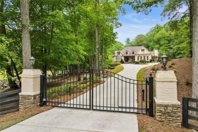 Enter through the stately gated entry and meander along the on Alpharetta Athletic Club East in Georgia - for sale on GolfHomes.com, golf home, golf lot