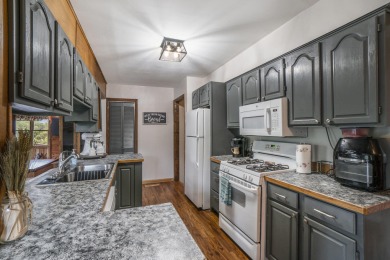 Well-maintained 4 bedroom, 2 bath home offering a spacious and on The Loon Golf Resort in Michigan - for sale on GolfHomes.com, golf home, golf lot