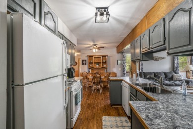 Well-maintained 4 bedroom, 2 bath home offering a spacious and on The Loon Golf Resort in Michigan - for sale on GolfHomes.com, golf home, golf lot