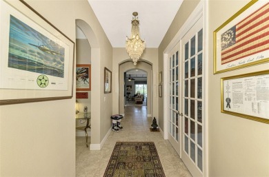 Prepare to be impressed by this beautifully upgraded one-owner on Sarasota National Golf Club in Florida - for sale on GolfHomes.com, golf home, golf lot