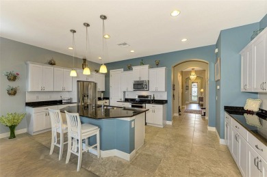 Prepare to be impressed by this beautifully upgraded one-owner on Sarasota National Golf Club in Florida - for sale on GolfHomes.com, golf home, golf lot