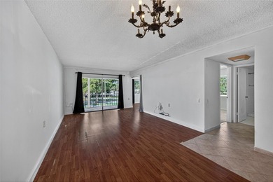 GREAT VALUE!!! LOWEST PRICED IN WYNMOOR, NO UPCOMING ASSESMENT! on Wynmoor Golf Course in Florida - for sale on GolfHomes.com, golf home, golf lot