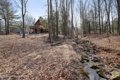 Nestled in the heart of a highly desirable four-season community on The Hideout Golf in Pennsylvania - for sale on GolfHomes.com, golf home, golf lot