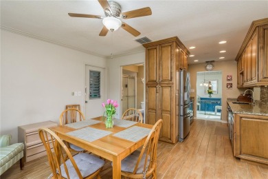 Located in the heart of Palm Harbor, 102 Stanford Drive is on Highland Lakes Executive Golf Course in Florida - for sale on GolfHomes.com, golf home, golf lot