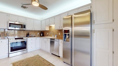 Immaculate 2nd floor three-bedroom, two-bathroom condo on Pipers Landing Country Club in Florida - for sale on GolfHomes.com, golf home, golf lot
