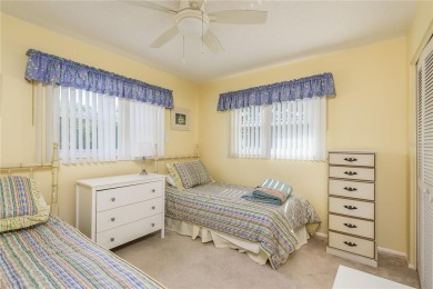 Located in the heart of Palm Harbor, 102 Stanford Drive is on Highland Lakes Executive Golf Course in Florida - for sale on GolfHomes.com, golf home, golf lot