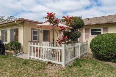 Located in the heart of Palm Harbor, 102 Stanford Drive is on Highland Lakes Executive Golf Course in Florida - for sale on GolfHomes.com, golf home, golf lot