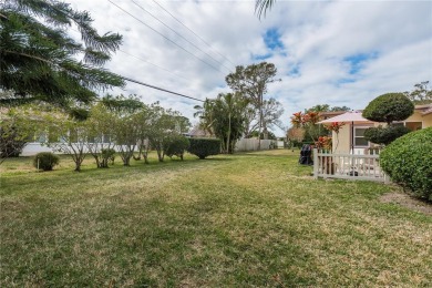 Located in the heart of Palm Harbor, 102 Stanford Drive is on Highland Lakes Executive Golf Course in Florida - for sale on GolfHomes.com, golf home, golf lot
