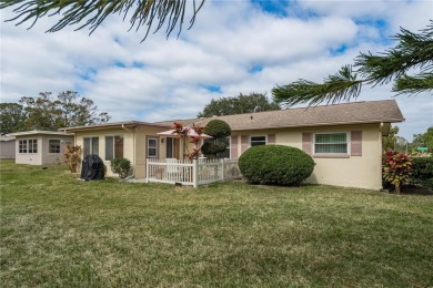 Located in the heart of Palm Harbor, 102 Stanford Drive is on Highland Lakes Executive Golf Course in Florida - for sale on GolfHomes.com, golf home, golf lot