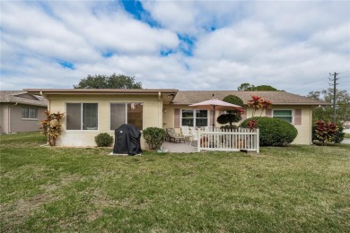 Located in the heart of Palm Harbor, 102 Stanford Drive is on Highland Lakes Executive Golf Course in Florida - for sale on GolfHomes.com, golf home, golf lot