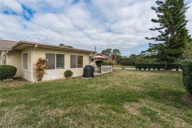 Located in the heart of Palm Harbor, 102 Stanford Drive is on Highland Lakes Executive Golf Course in Florida - for sale on GolfHomes.com, golf home, golf lot