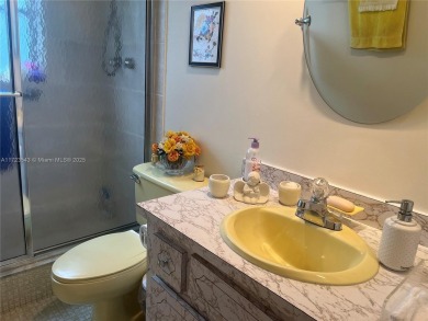Experience luxury in this coveted first-floor corner residence on Palm-Aire Country Club and Resort - Palms in Florida - for sale on GolfHomes.com, golf home, golf lot