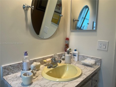 Experience luxury in this coveted first-floor corner residence on Palm-Aire Country Club and Resort - Palms in Florida - for sale on GolfHomes.com, golf home, golf lot