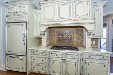 This custom home welcomes you with double front doors, an on Greystone Golf and Country Club-Founders Course in Alabama - for sale on GolfHomes.com, golf home, golf lot