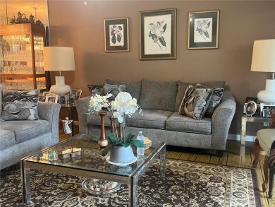 Experience luxury in this coveted first-floor corner residence on Palm-Aire Country Club and Resort - Palms in Florida - for sale on GolfHomes.com, golf home, golf lot