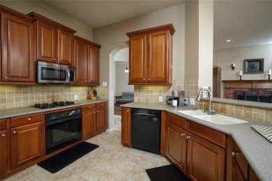 Located on an interior corner lot and shaded by beautiful mature on Stonebridge Ranch Country Club in Texas - for sale on GolfHomes.com, golf home, golf lot