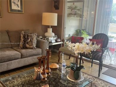 Experience luxury in this coveted first-floor corner residence on Palm-Aire Country Club and Resort - Palms in Florida - for sale on GolfHomes.com, golf home, golf lot