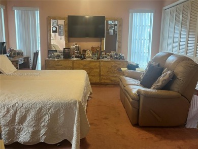 Experience luxury in this coveted first-floor corner residence on Palm-Aire Country Club and Resort - Palms in Florida - for sale on GolfHomes.com, golf home, golf lot