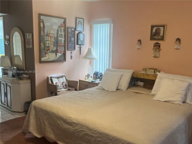 Experience luxury in this coveted first-floor corner residence on Palm-Aire Country Club and Resort - Palms in Florida - for sale on GolfHomes.com, golf home, golf lot