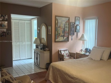 Experience luxury in this coveted first-floor corner residence on Palm-Aire Country Club and Resort - Palms in Florida - for sale on GolfHomes.com, golf home, golf lot