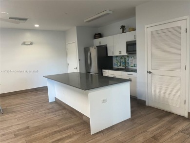 Experience luxury in this coveted first-floor corner residence on Palm-Aire Country Club and Resort - Palms in Florida - for sale on GolfHomes.com, golf home, golf lot