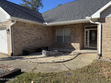 Welcome home to this recently updated 3-bedroom, 2-bath brick on Diamondhead Country Club in Mississippi - for sale on GolfHomes.com, golf home, golf lot